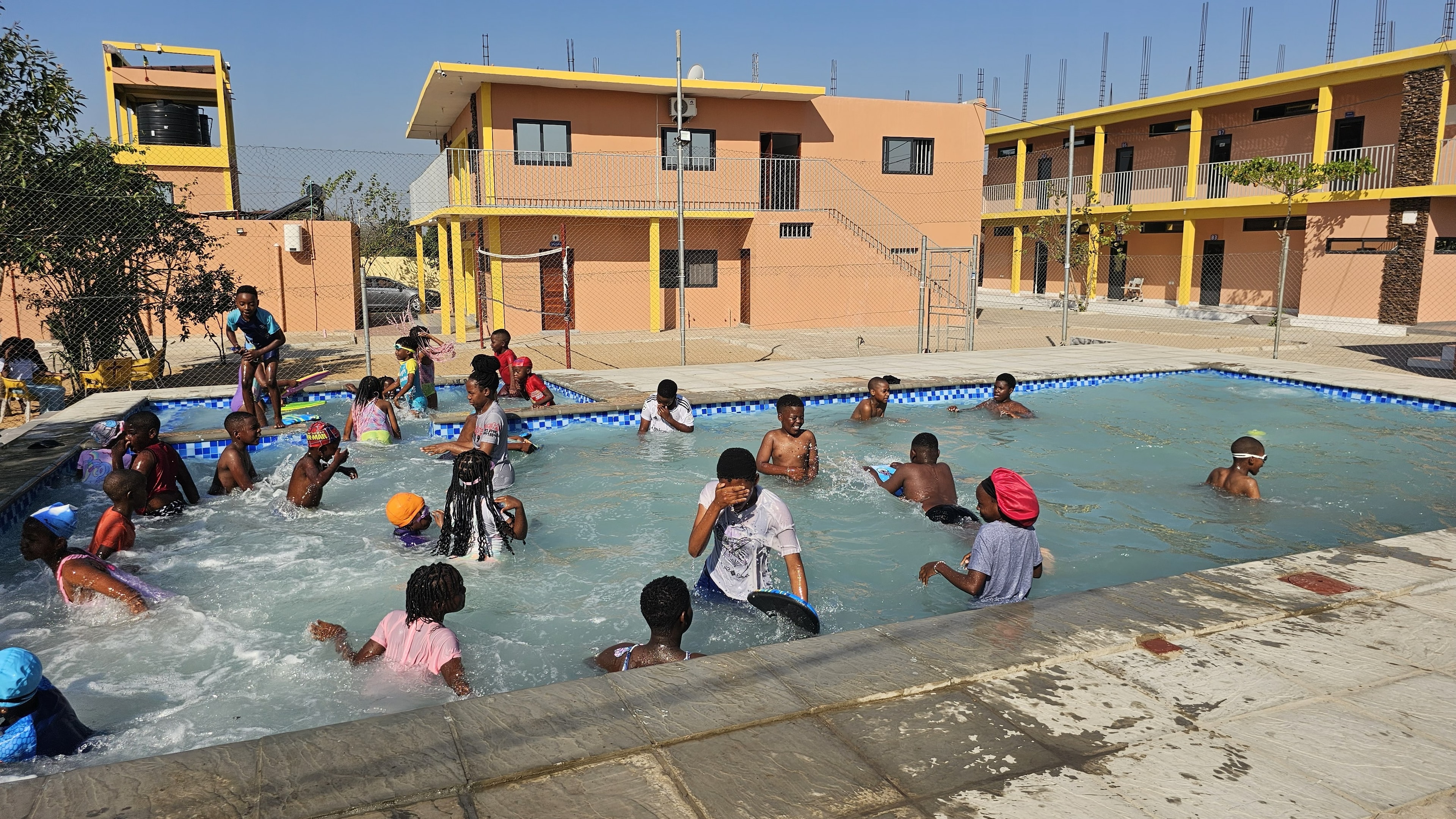 MGIS learners enjoying the outdoor swimming pool